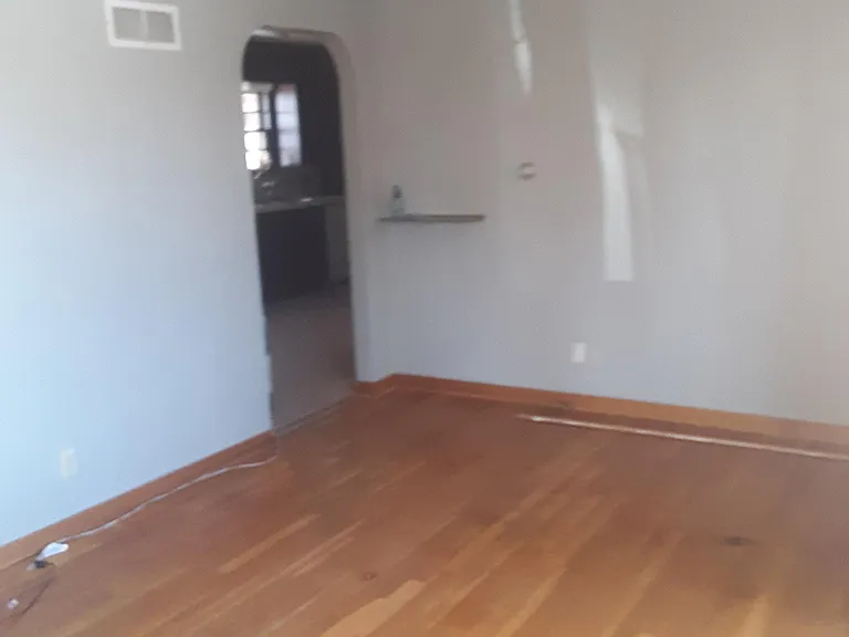 Living room showing the living/family room w the entry way into the kitchen