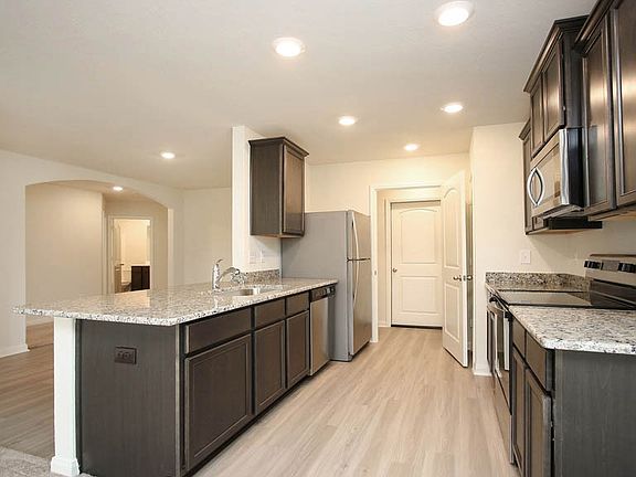 The chef ready kitchen comes with stainless steel appliances and granite countertops