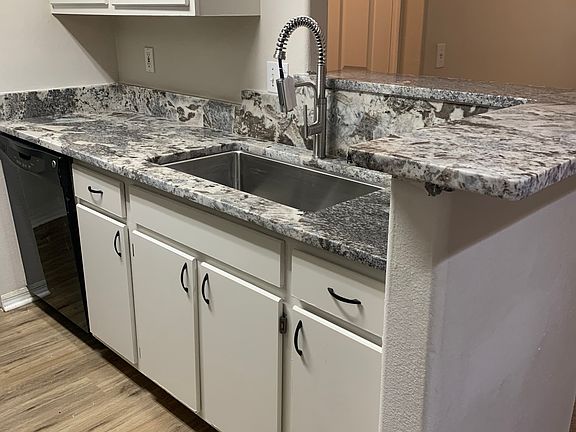 Upgraded cabinets and new countertops, gourmet sink and faucet! New wood flooring installed!