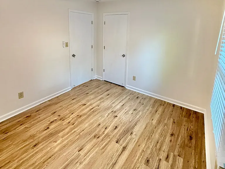 Family-ready second bedroom_ new ceiling fan and new blinds provide gentle breeze and light control - ideal for kids' play, study sessions or quiet downtime