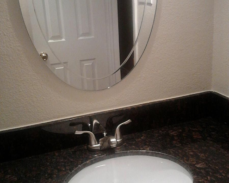 Guess bathroom with granite counter tops