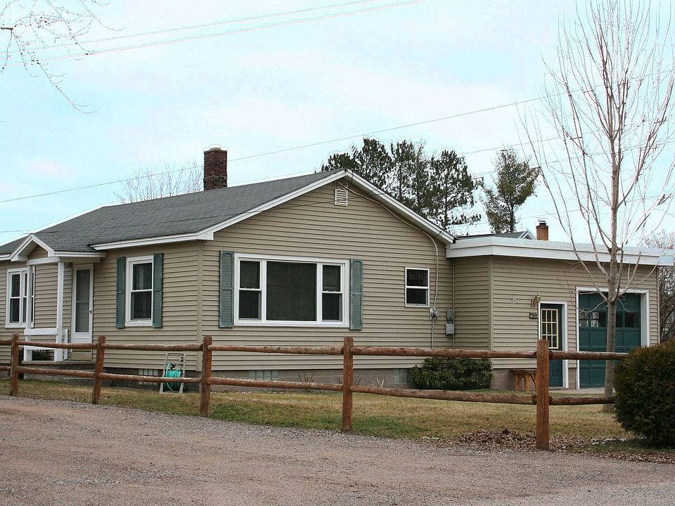 So cute from street with split rail fence and shrubs