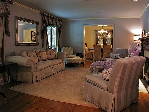 The formal living room and dining room both feature hardwood floors.