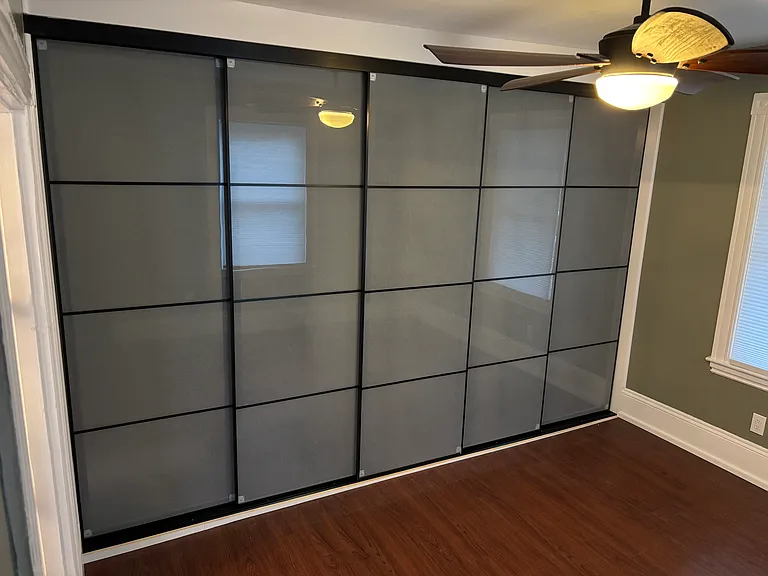 Master bedroom closet - 5 sliding glass doors for 12' of custom closet space