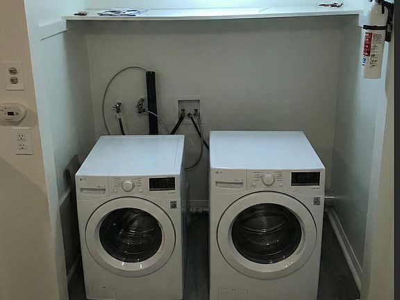 The Washer and dryer are located in the kitchen