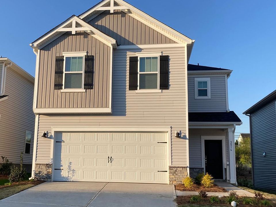 Welcome home! modern two-story with 2-car garage, covered porch, and low-maintenance landscaping