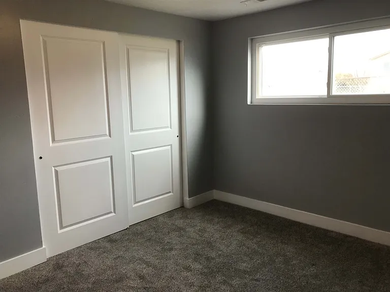 bedroom view with closet doors