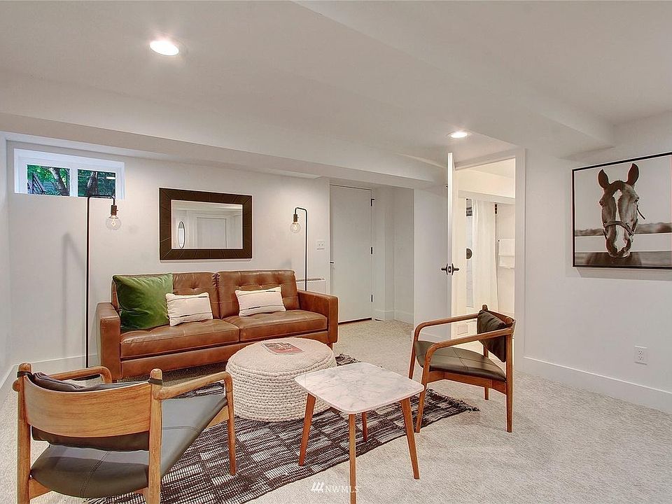 Living room (all rooms are unfurnished). Left door leads to the backyard. Door on right is your private bathroom.