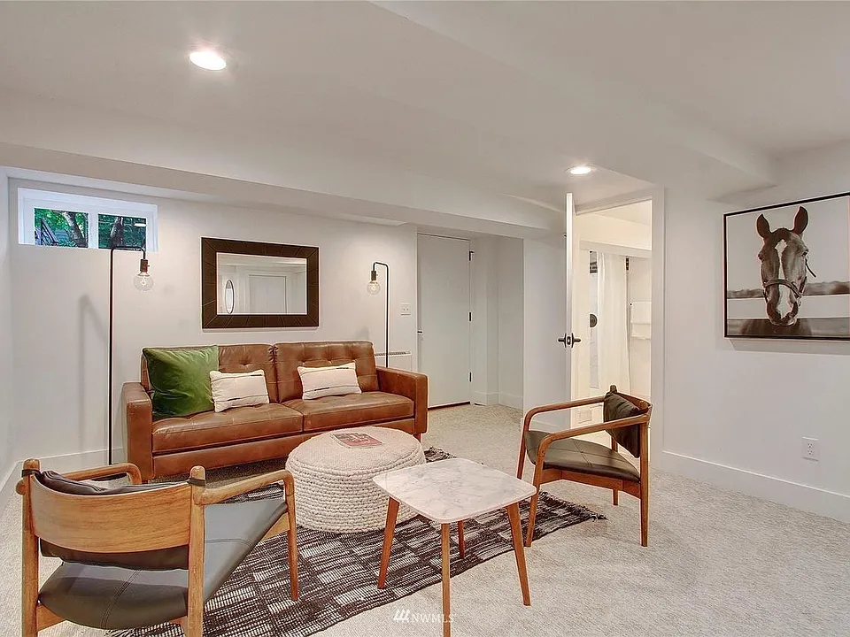 Living room (all rooms are unfurnished). Left door leads to the backyard. Door on right is your private bathroom.