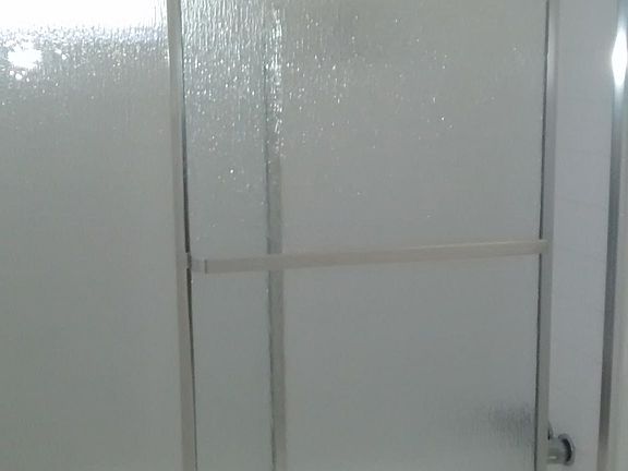 new shower doors and rain shower head / faucets