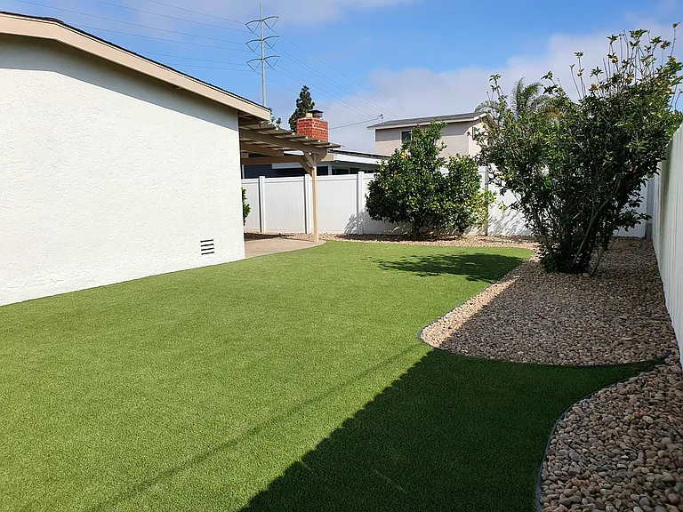 Low maintenance backyard with mature fruit trees