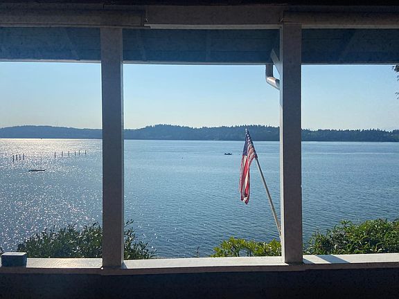Covered porch but not enclosed, so you can breathe the fresh sea air