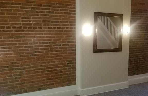 After Living room wall with exposed brick. Nice accent to living room.