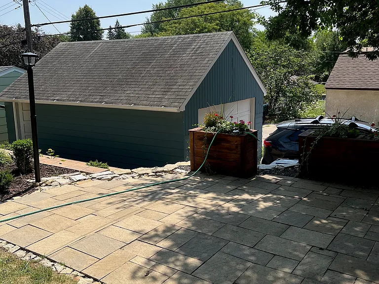 Backyard Patio area - view of the two car garage