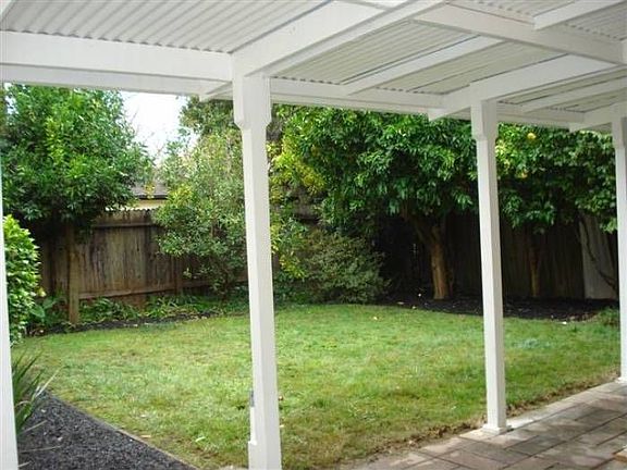 grassy backyard w/ trees