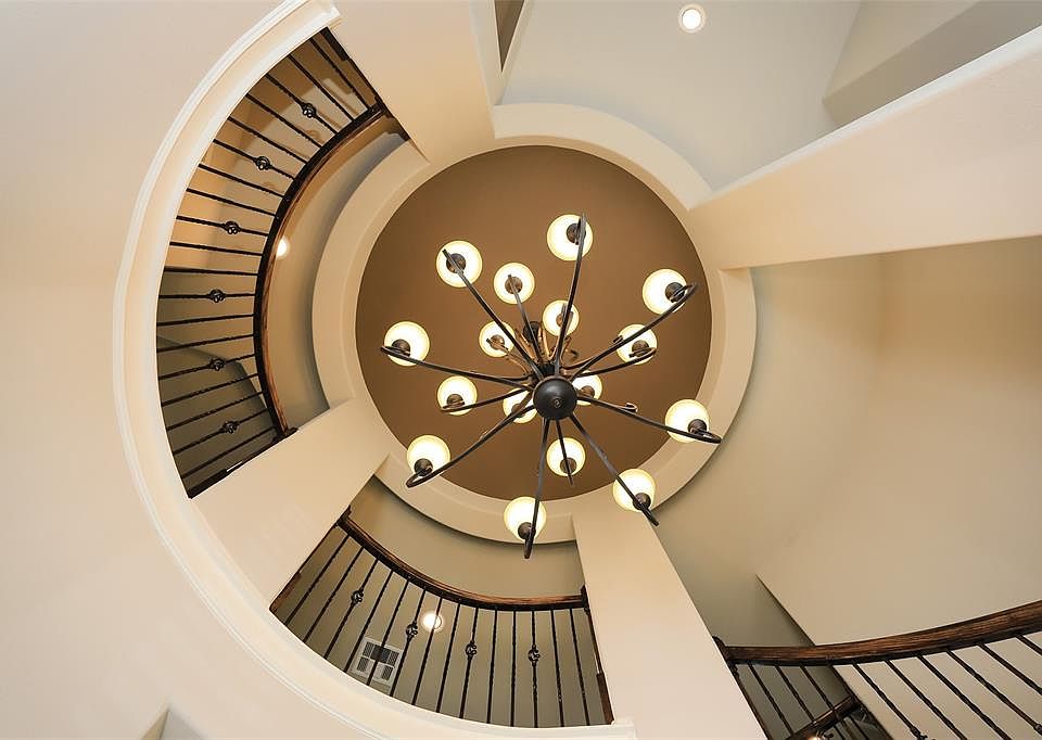 The rotunda ceiling in the entry is beautiful and dramatic. A gorgeous view to come home to!