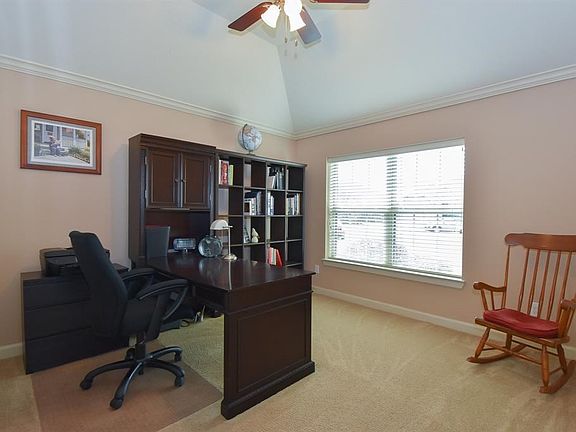 Spacious study with raised ceiling.