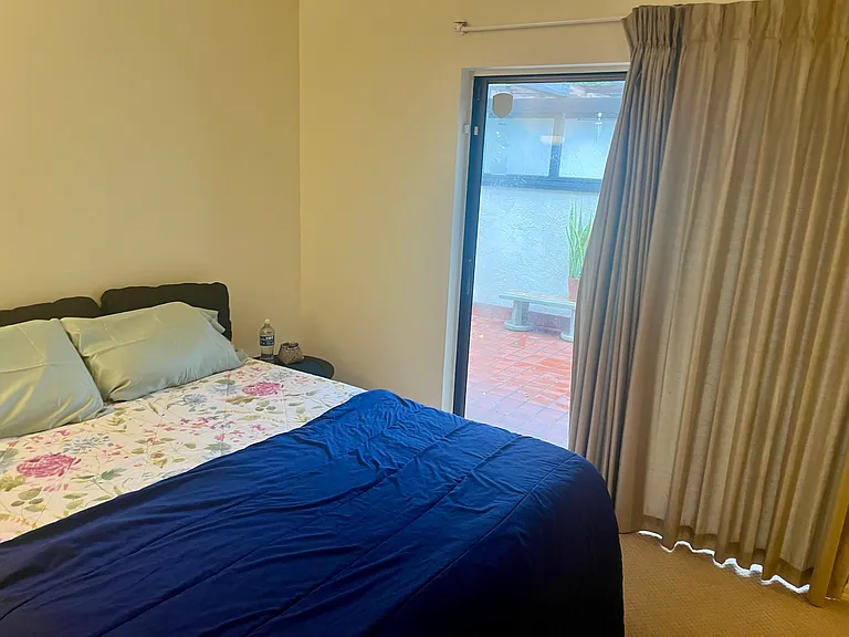 Large 2nd bedroom with sliding doors to front patio.