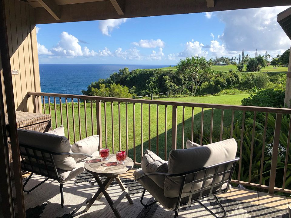 Cozy lanai with 4 large comfortable chairs and side tables.