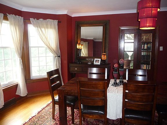 Fromal dining room w/ bay window and french doors leading to sunroom