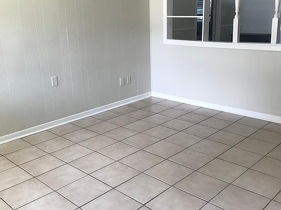 Standing by front door, pic of back wall of living area