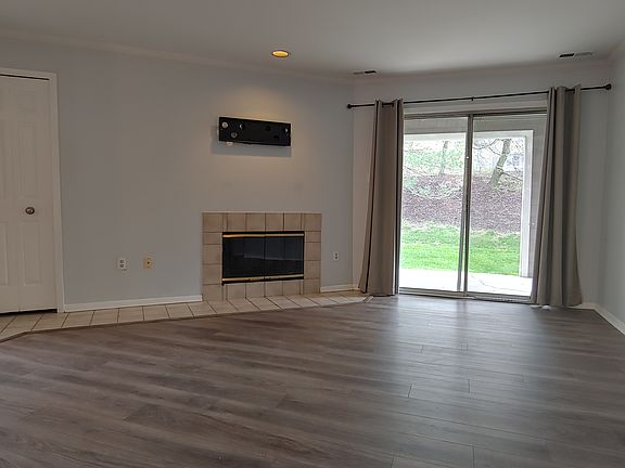 Open living area with wood burning fireplace