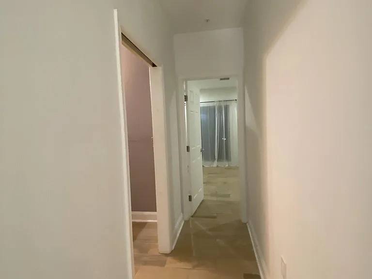 hallway to master room and hallway bath
