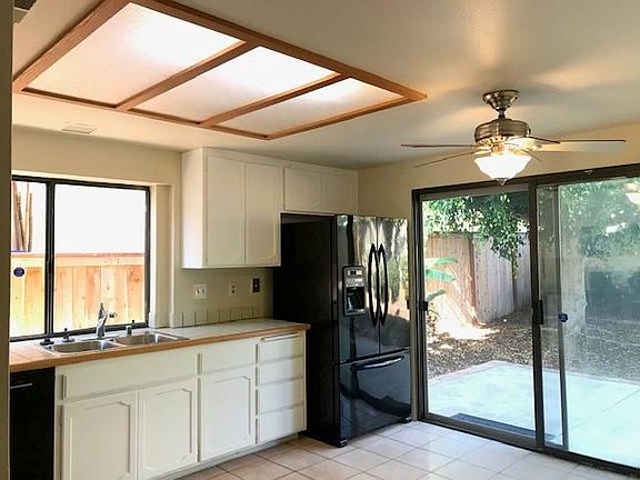 Large kitchen leads to fully fenced yard
