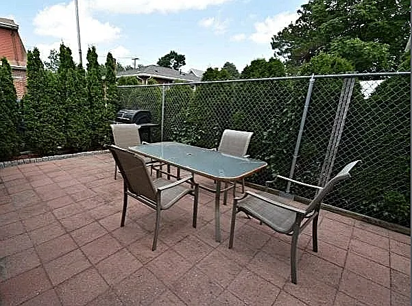 Patio area shared with upstairs unit.