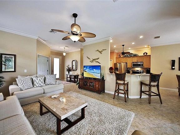 Living area to kitchen. Just enough room for family & friends.