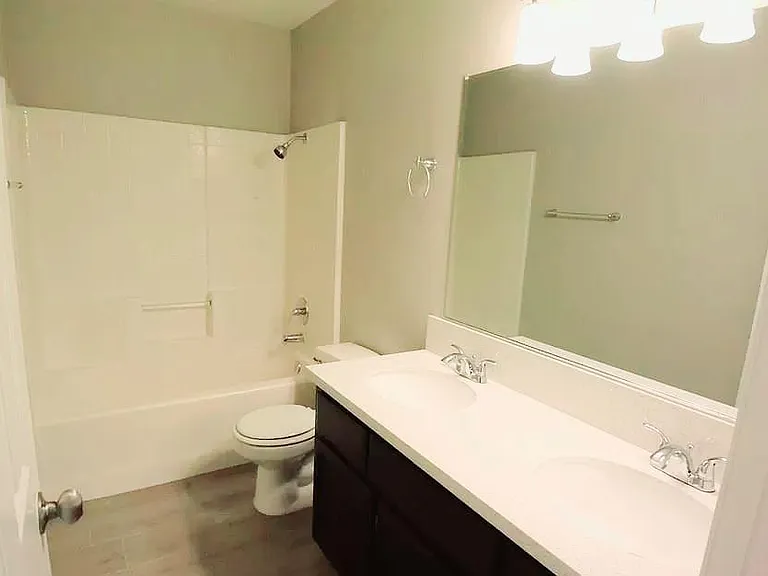 Second Bathroom with double vanities and bath tub