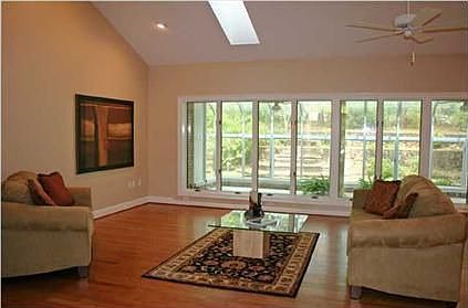High ceilings, burnished wood floors, Andersen window wall...