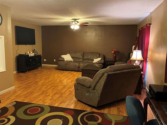 Spacious living room open to the dining room and kitchen