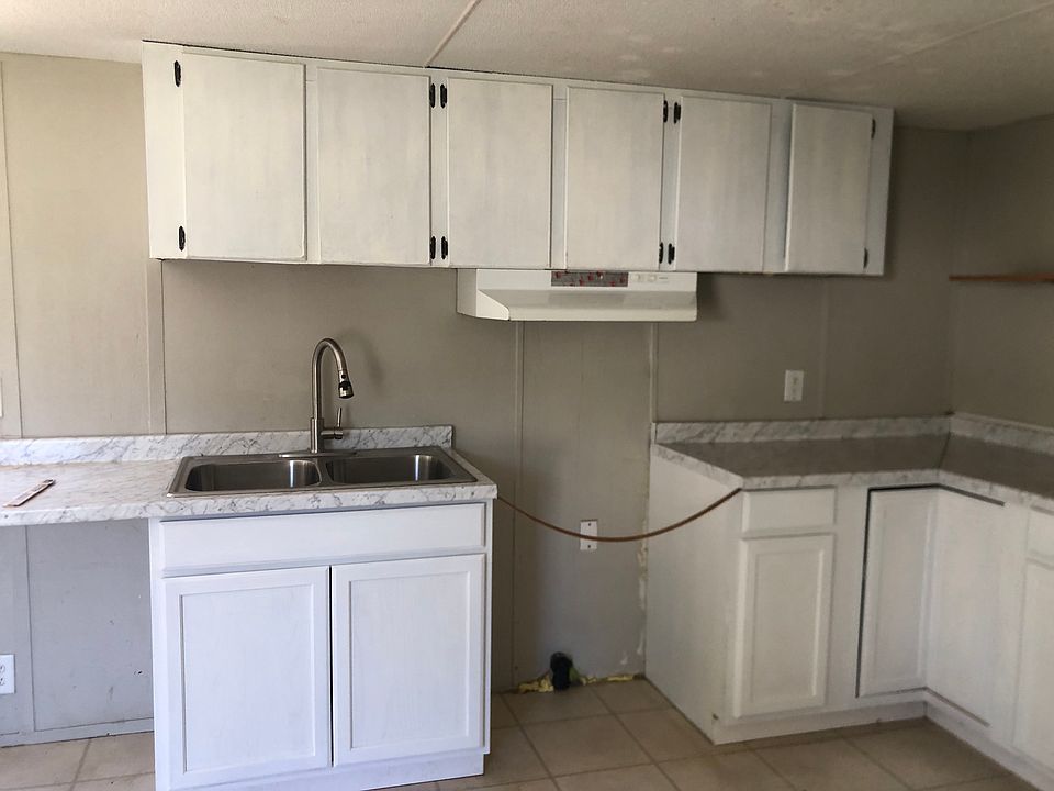 New bottom cabinets, sink, faucet and countertops.