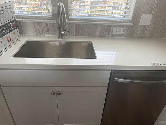 Deep kitchen sink, with beautiful moen faucet.
