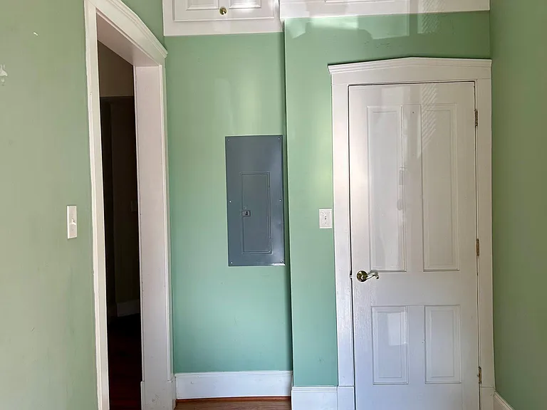 Foyer with storage, Living room through the left