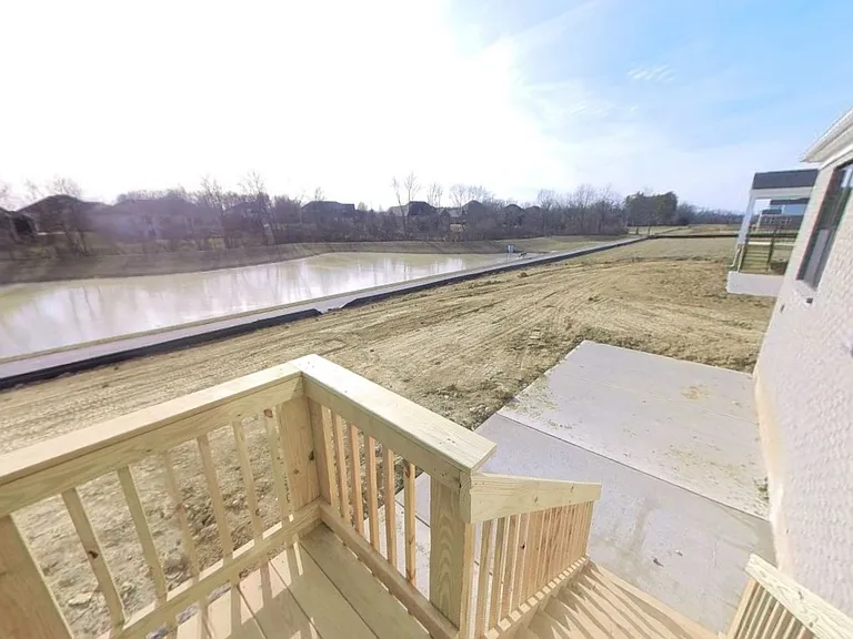 Backyard and patio area overlooking the pond and walking trail.