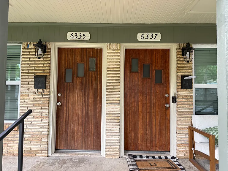 Charming original hardwood doors. The left side is for lease.