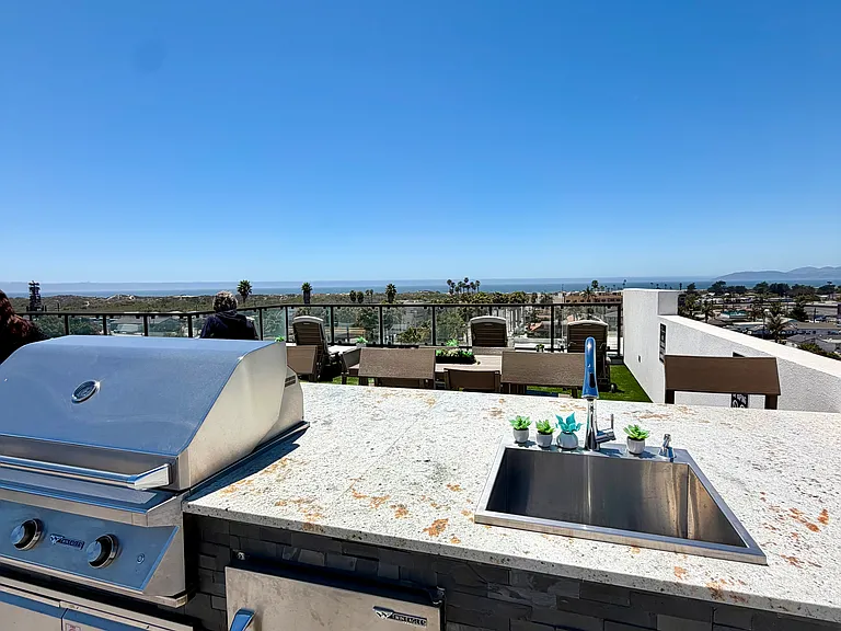 BBQ on communal rooftop deck in sister building