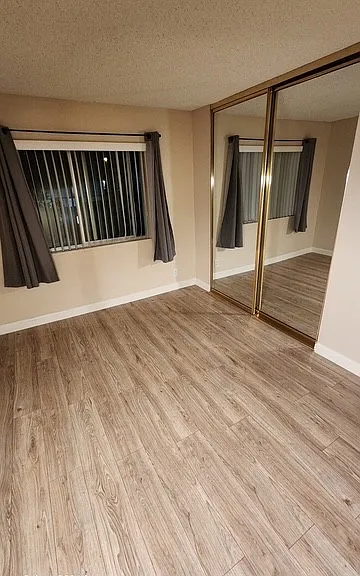 Bedroom 2, with closet built-ins.