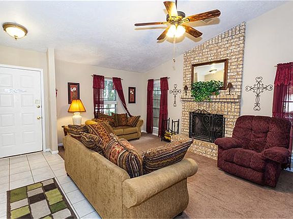 Den has cozy fireplace!