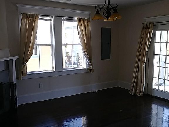 Spacious living room with gas logs. French do it to front po