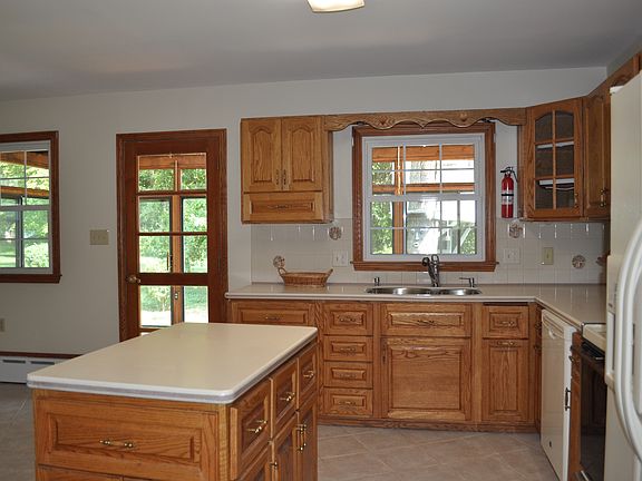 Large eat-in kitchen w/custom cabinets.
