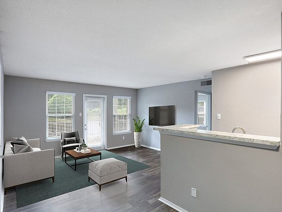 Model living room with wood style flooring