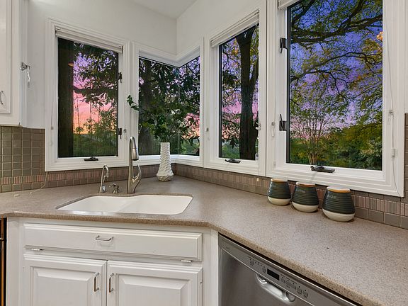 Captivating hill county views through the corner glass.