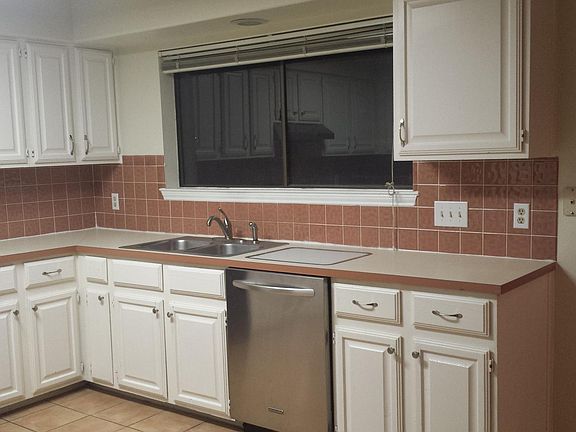 Kitchen with large window facing back yard
