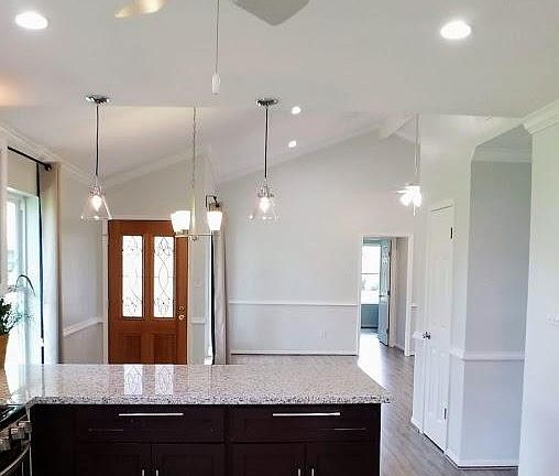 View from kitchen toward the dining area and front door.