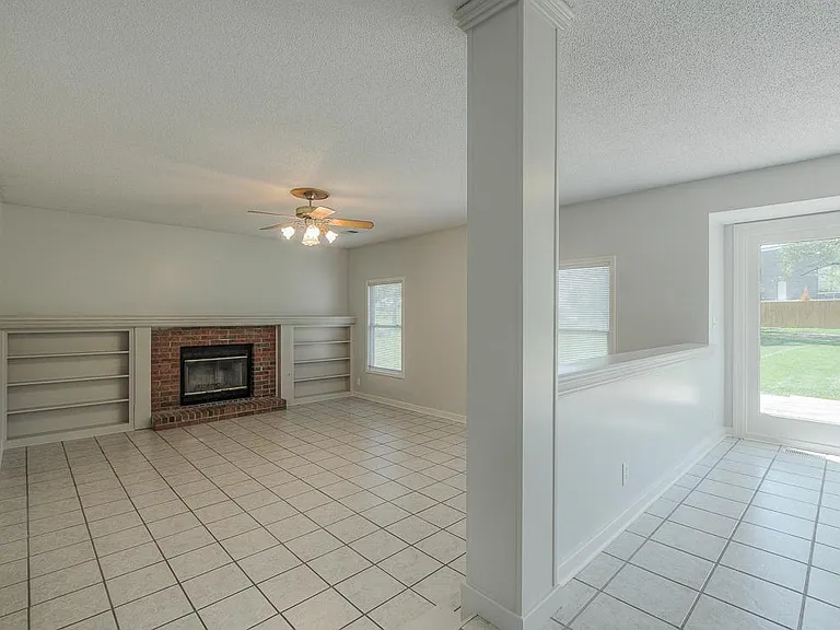The spacious family room is an extension of the kitchen and breakfast area for easy, casual entertaining or family night at home.