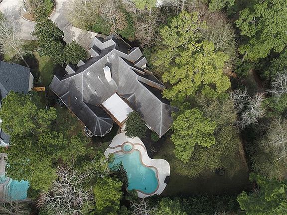 The large heated pool and spa with plenty of grassy space and a large covered patio.