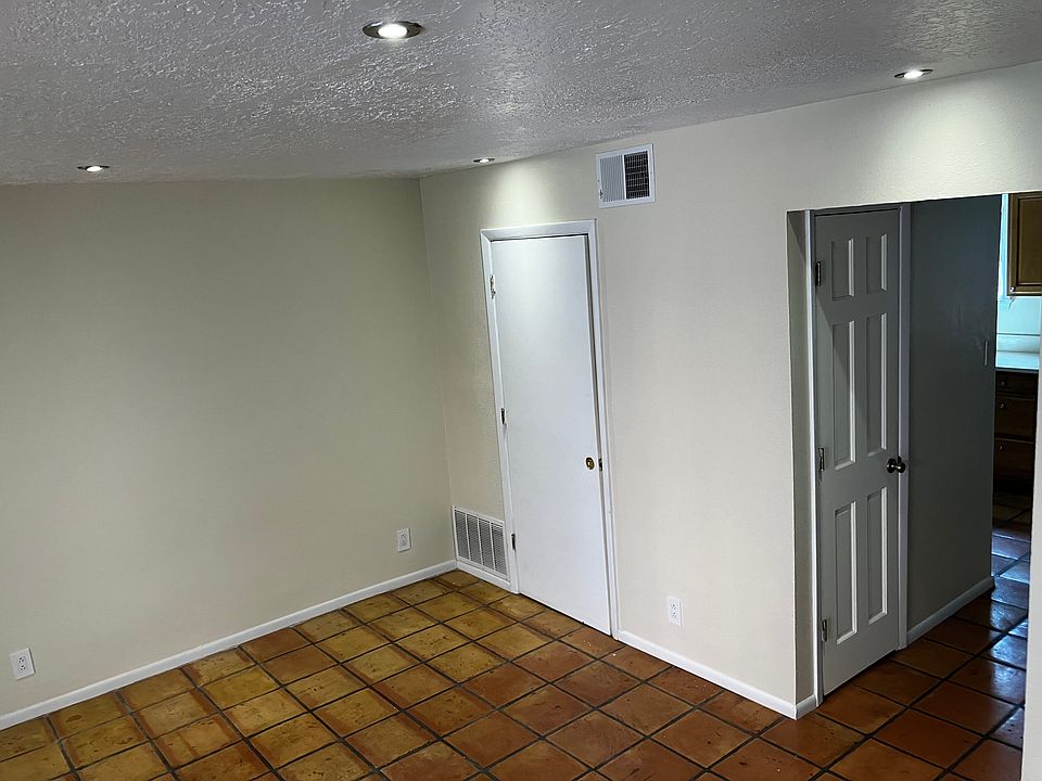 Living room: view leading to dining area/kitchen